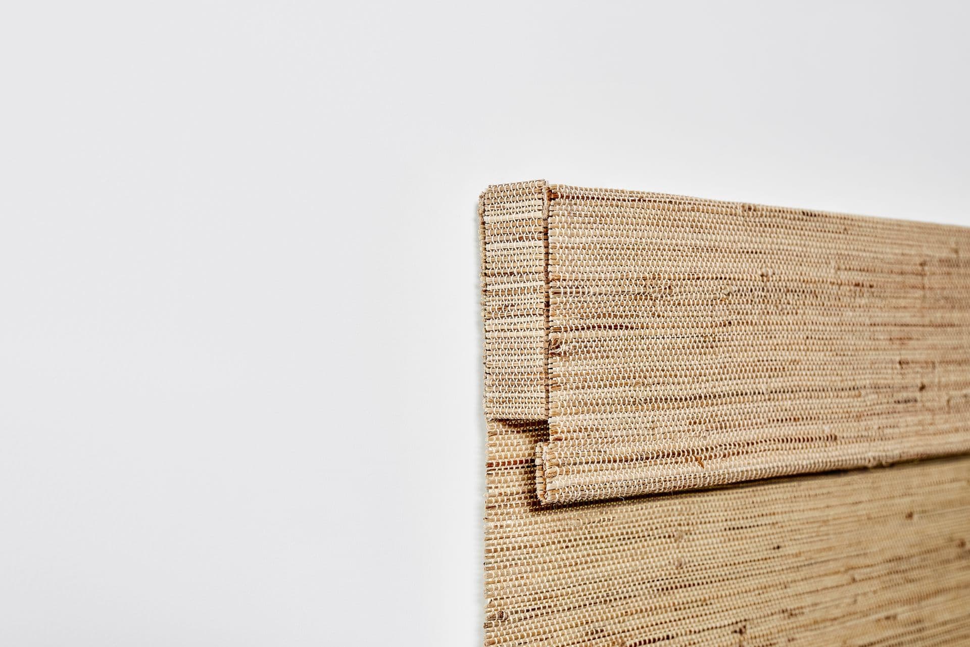 Fabric returns on an outside mounted woven wood shade