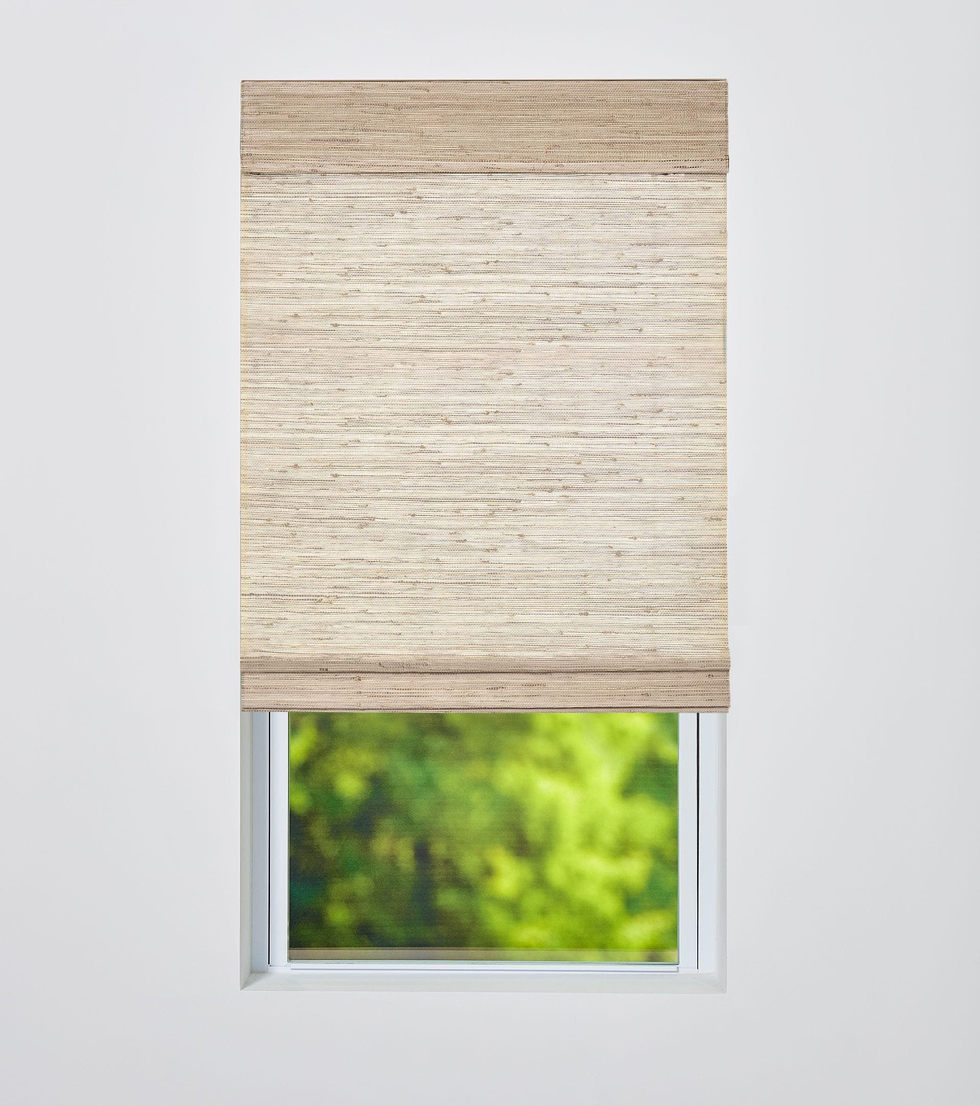 Woven wood shade with a light filtering liner