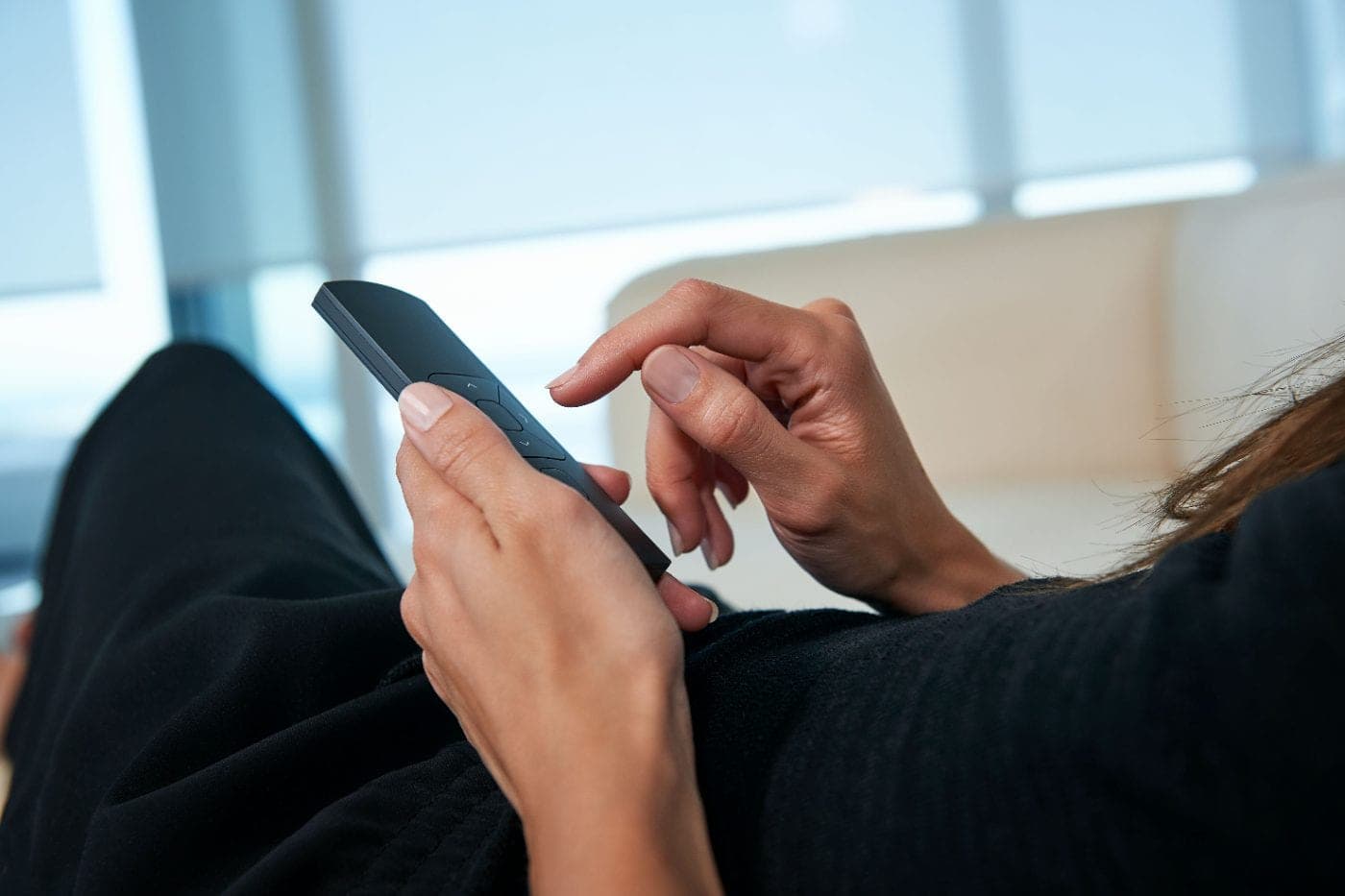 A remote held in one hand